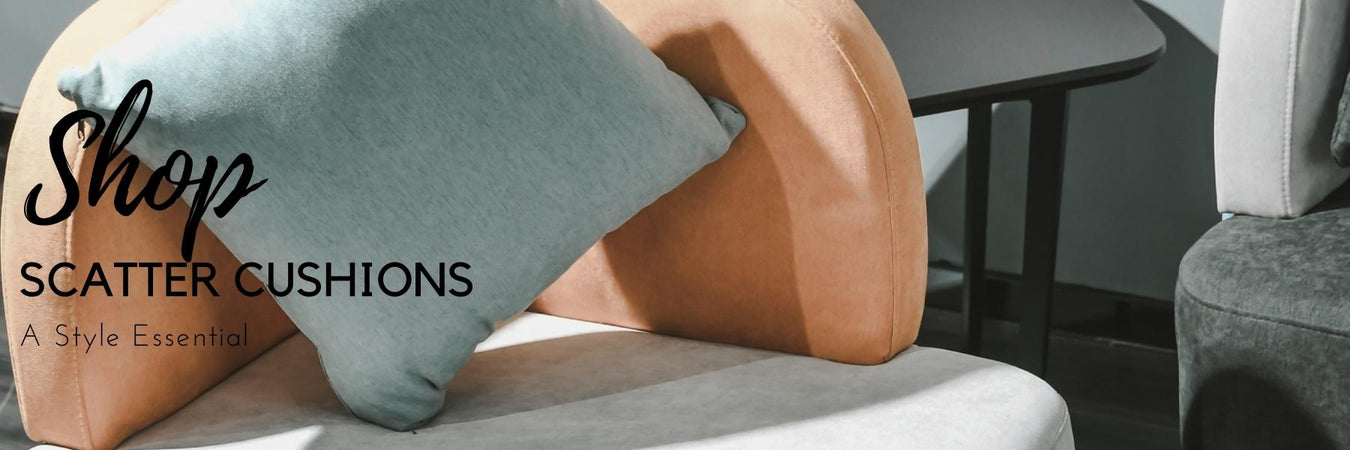 Assortment of textured scatter cushions arranged on a sofa