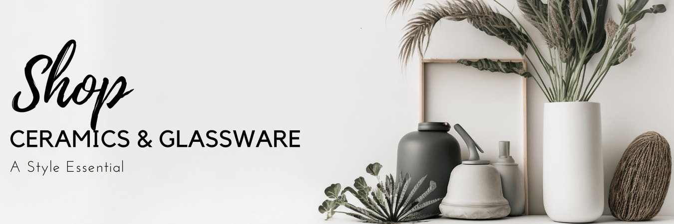 Ceramic vases and glassware styled on a shelf