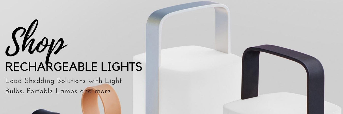 Cordless rechargeable table lamp glowing on a patio table