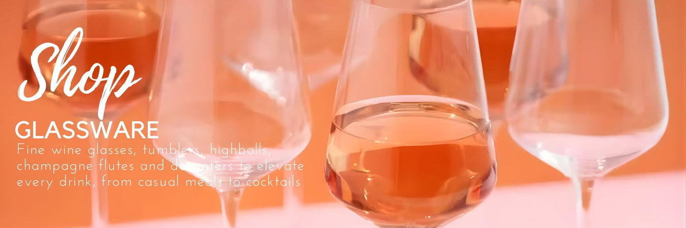 Wine glasses and decanters arranged on a dining table