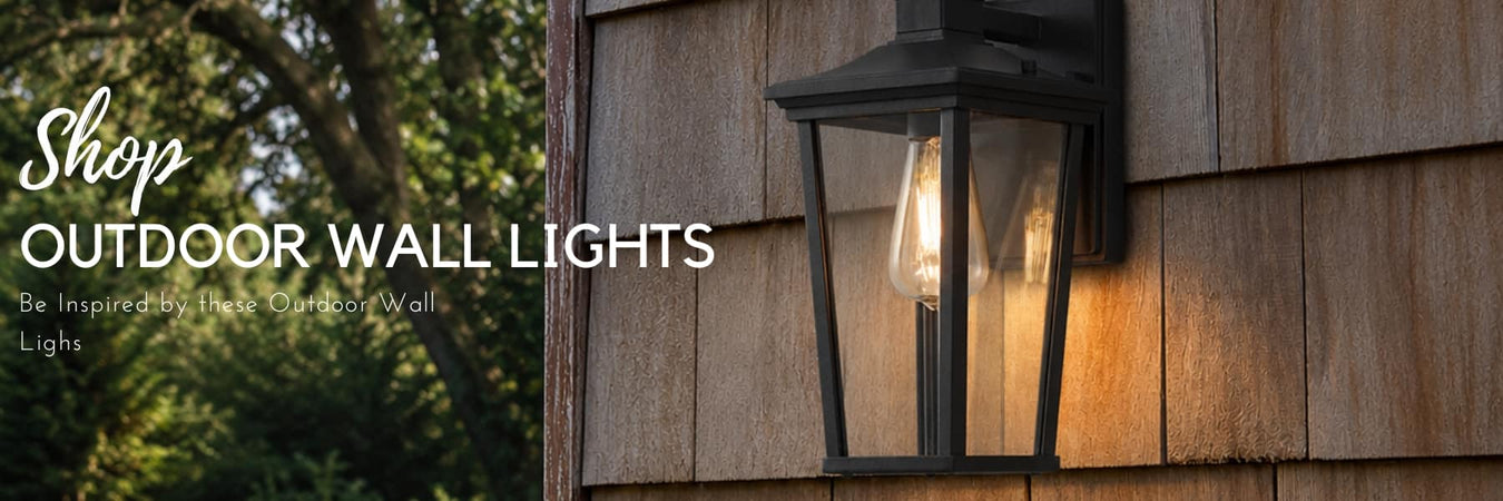 Matte black outdoor wall light mounted beside a front door at dusk