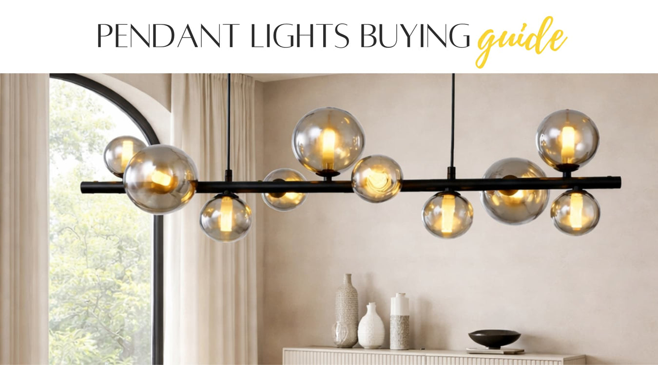 Modern pendant light fixture with glass bulbs in a living room setting.