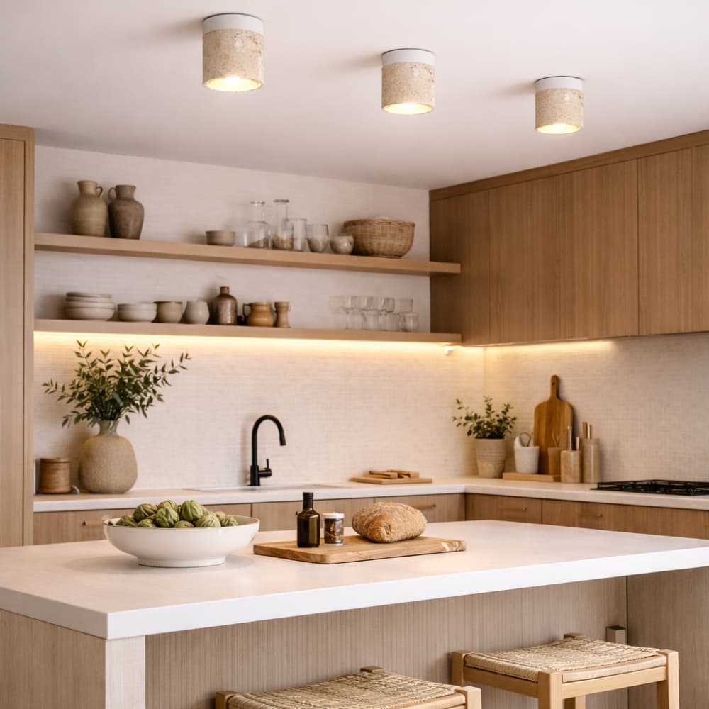 Modern kitchen with wooden cabinets, white countertops, and decorative elements.