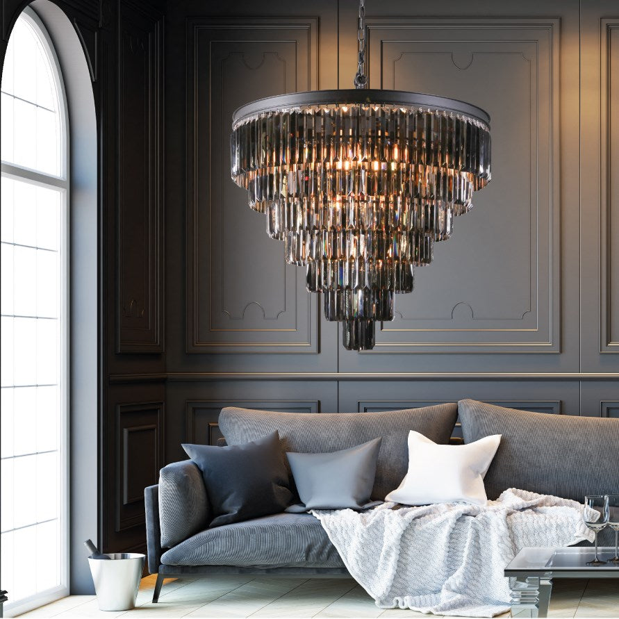 Chandelier hanging above a gray sofa in a stylish living room.