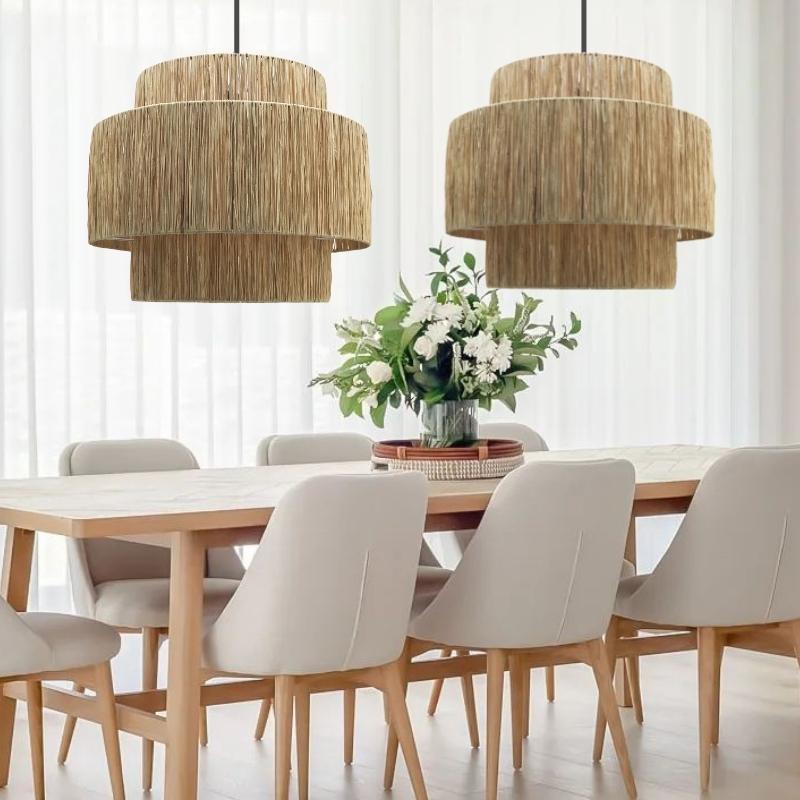 Natural rattan pendant lights above a light wood dining table in a modern Japandi dining room – Lighting.co.za