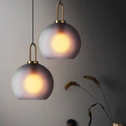 Ebbe Round Smoke Grey Glass and Antique Brass Pendant Light - Lighting.co.za