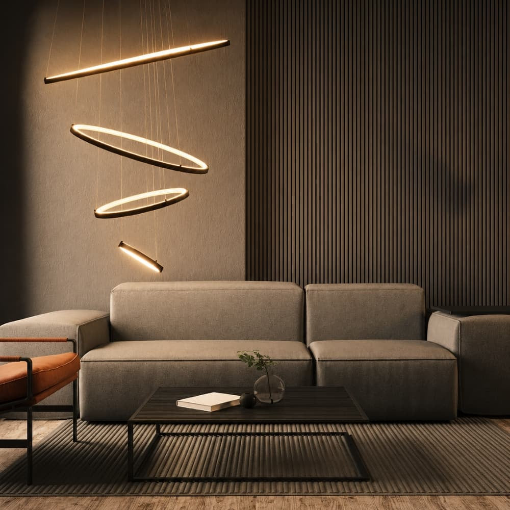 Modern living room with a gray sofa, coffee table, and hanging lights. Pendant lights buying guide. What height should pendants hang - Lighting.co.za