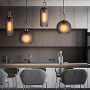 Ebbe Round Smoke Grey Glass and Antique Brass Pendant Light - Lighting.co.za